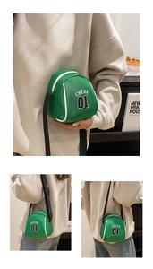 Detail view of mini green canvas crossbody bag featuring white CHINA 01 letter print