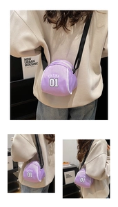 Detailed close-up showing purple canvas mini bag with adjustable strap and CHINA 01 print