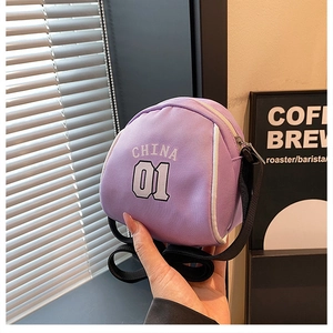 Close-up of purple canvas mini crossbody bag featuring white CHINA 01 lettering