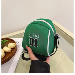 Detail of green canvas mini crossbody bag with CHINA 01 print and white zipper