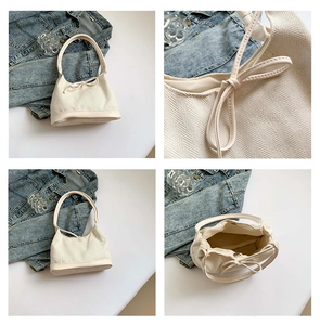 Detailed views of cream canvas tote bag showing herringbone texture and bow detail