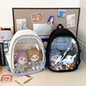 Detail view of large capacity ita bags with clear PVC windows showing cotton dolls