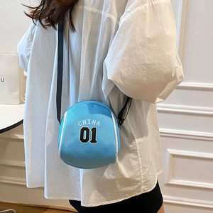 Sky blue basketball-shaped mini crossbody bag with China 01 logo on white shirt
