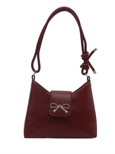Minimalist burgundy underarm bag with silver bow accent and slim shoulder strap