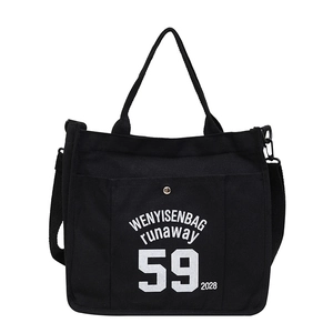 Black canvas tote bag with graphic print for street style daily commuting