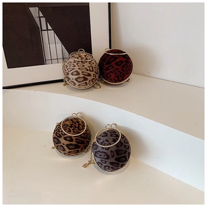 Spherical leopard print evening bags with gold ring handles in multiple colors