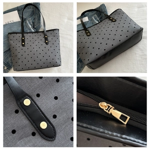 Detail view of grey canvas polka dot tote bag showing golden studs and zipper hardware