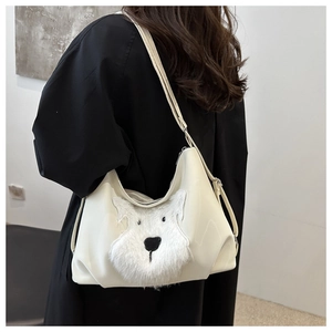 Detail of white PU leather shoulder bag with fluffy dog patch and metal strap buckle