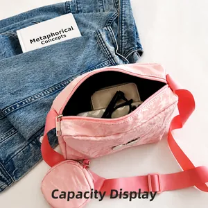 Capacity display of the pink crossbody bag showing storage for glasses and wallet