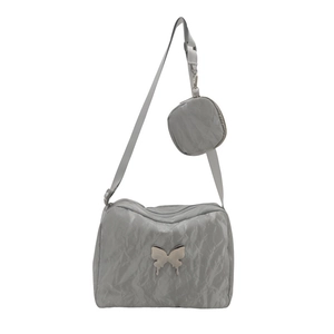 Grey autumn quilted crossbody bag with butterfly charm and small round pouch attachment