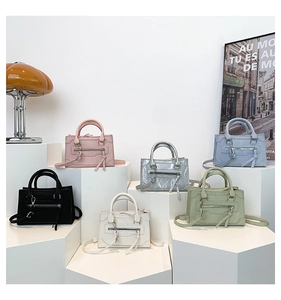Close-up of elegant mini trapezoid handbags in six colors on minimalist podiums