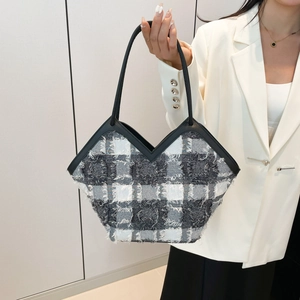 Classic black and white checkered tweed tote bag with fringe edge and thin black handles