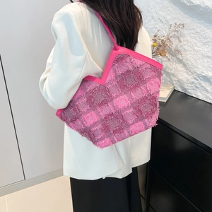 Pink woven plaid tote bag with fringe details and long shoulder strap for women