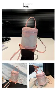 Pink cylinder bucket bag with traditional scenery print and silver metal zipper detail