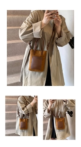 Vintage brown suede crossbody bag styled with a khaki trench coat on indoor stairs