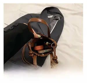Interior view of leopard print crossbody bag showing space for phone and cosmetics