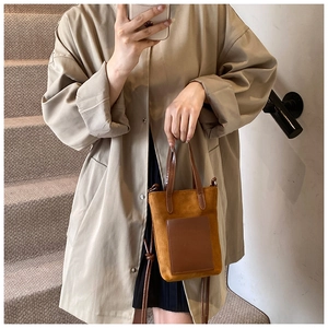 Detail of vintage leopard style crossbody bag in suede texture with dark brown front pocket