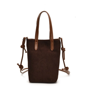 Retro brown suede crossbody bag for women with dual leather top handles and knot detail