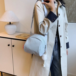 Minimalist light blue vintage square canvas crossbody bag with plush charm and strap
