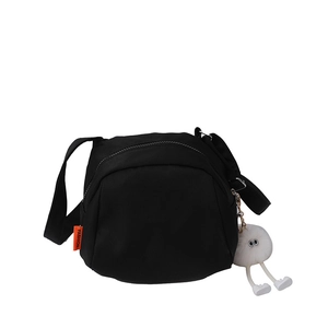 Minimalist black vintage canvas crossbody bag with fluffy charm and adjustable strap