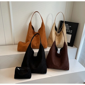 Detail of four hobo bags in suede-like fabric with matching small inner pouches