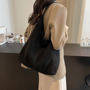 Minimalist black suede large tote bag with wide shoulder strap for casual fashion
