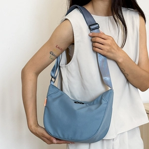 Minimalist fog blue crescent hobo bag for women featuring wide adjustable shoulder strap