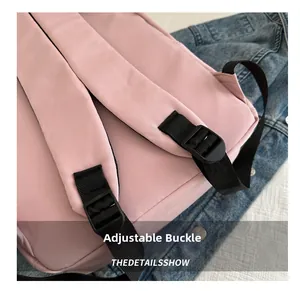 Close-up of adjustable straps and buckles on a pink backpack for school girls