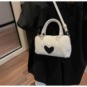 White faux fur handbag with black leather heart detail and adjustable shoulder strap