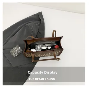 Spacious interior of leopard print tote bag showing storage for daily essentials