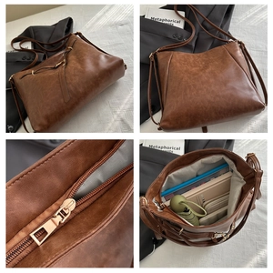 Detail view of large brown retro tote bag showing interior capacity and zipper hardware
