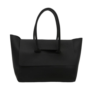 Elegant large black matte faux leather tote bag with unique handle for women's daily commute