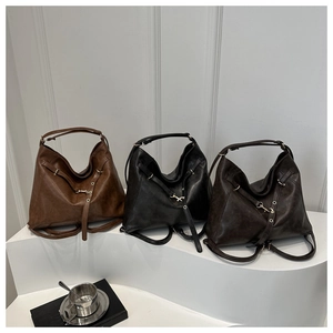 Detailed view of large retro tote bags in dark brown, charcoal black, and deep coffee colors