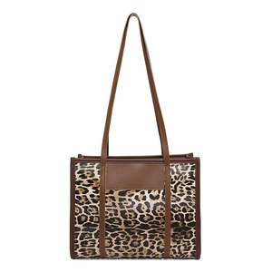 Vintage leopard print tote bag with brown leather trim and spacious interior for women