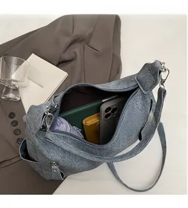 Detail view of large grey-blue canvas tote bag interior with zipper pocket and ample space
