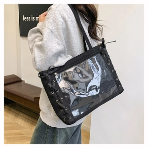 Detail of black canvas ita bag with clear PVC window and decorative side ribbon lacing