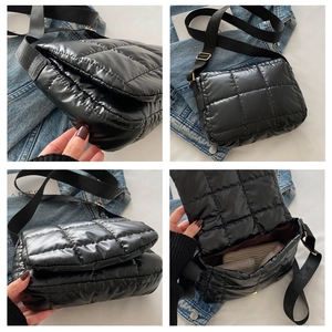 Detail der schwarzen Stepptasche mit breitem Nylongurt und geräumigem Innenraum