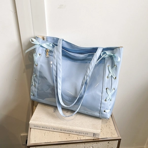 Light blue Japanese style tote bag with transparent PVC layer and ribbon bow accents