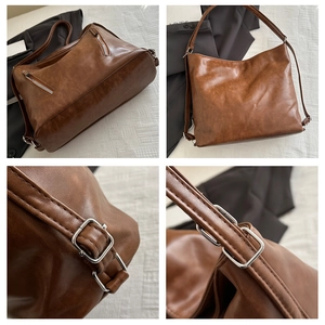 Dettaglio borsa tote vintage marrone con cerniere e trama in finta pelle pregiata