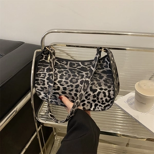 Chic grey leopard print crescent shoulder bag with adjustable gold buckle hardware