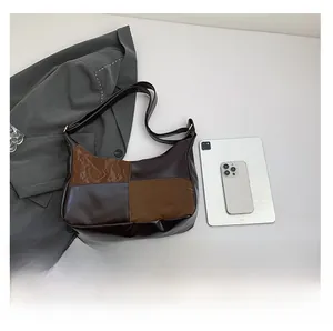 Size comparison of a contrast color tote bag with a tablet and phone on white desk