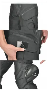 Detail of abrasion-resistant tactical pants with zipper pockets and knee armor slots