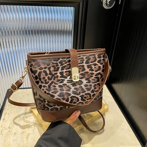 Fashion leopard print bucket bag with brown leather trim and golden twist lock closure