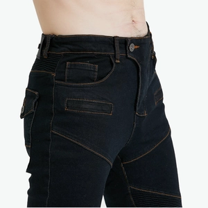 Detail of motorcycle jeans showing accordion stretch panels and orange contrast stitching
