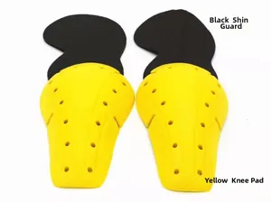 Detail of yellow knee pads and black leg protectors with breathable honeycomb holes