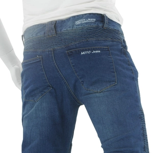 Detail of blue motocross jeans showing accordion stretch panels for flexible riding comfort