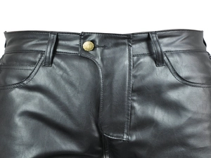 Detail of black motorcycle leather pants featuring belt loops and a golden V-logo button
