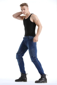 Detail shot of navy blue motorcycle jeans showing reinforced knee pleats and stitching