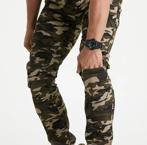Detail of slim-fit camo motorcycle pants featuring flexible pleated knee panels