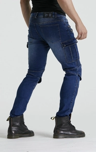 Detail of slim-fit motorcycle jeans featuring pleated stretch panels and cargo pockets